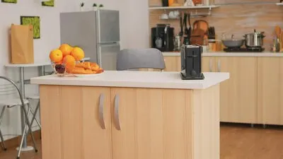 Shot of kitchen with nobody in it. Modern dining room with coffee machine in cozy interior with technology and furniture, decoration and architercture, comfortable room