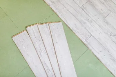 Bright laminated flooring boards on gray