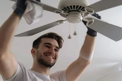 Portrait of modern man cleaning and doing household chores
