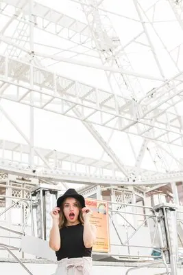 Happy young girl in the amusement park