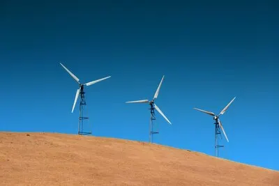 Wind turbine over mountain near San Francisco.