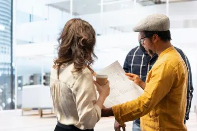 Real estate agent advising clients on office relocation and leasing