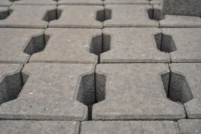Pallet with gray paving slabs closeup selective focus repair of roads and walking paths