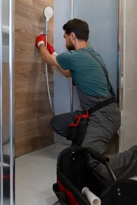Side view man working as plumber