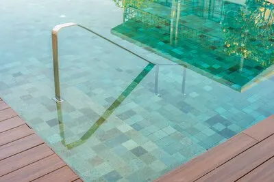 Outdoor swimming pool with stair ladder around there