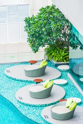 Umbrella chair around swimming pool