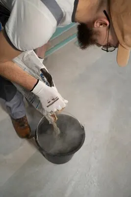 Tiler working on renovation of apartment