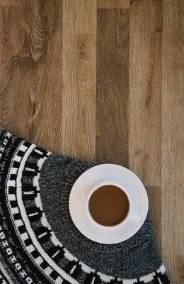 Cup of drink on sweater