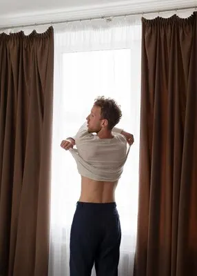 Medium shot man undressing
