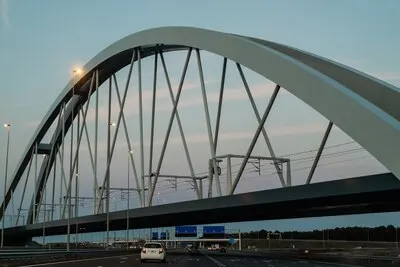 sunset bridge over the road.