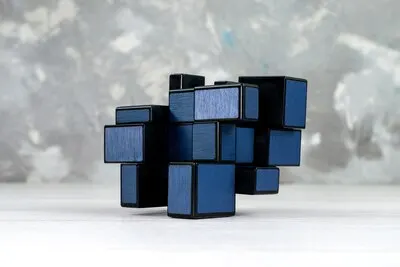 dark toy constructions designed and shaped on light,  toy plastic rubics cube