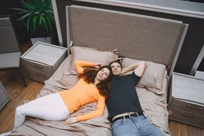 Couple choosing furniture in furniture store