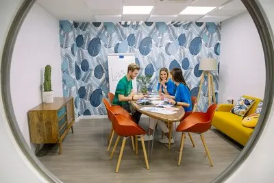 Social media team having discussion at luxury workplace