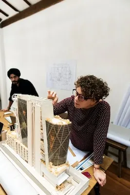 Woman working on model example for work