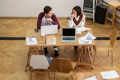 Classmates learning together in group study session