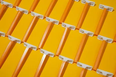 Top view razor blades with yellow background