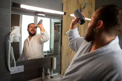 Medium shot man wearing bathrobe